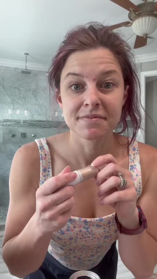 Jaclynn holding a ColourPop Tint Balm Stick during her own product demonstration